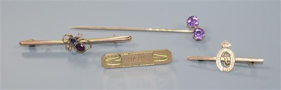 Two early 20th century 9ct gold brooches including gem set bug brooch, a yellow metal stick pin and one other brooch.